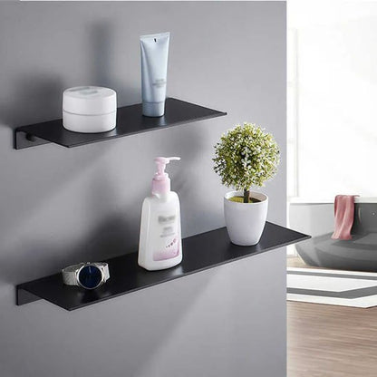 etagere de douche deux bibelots dessus