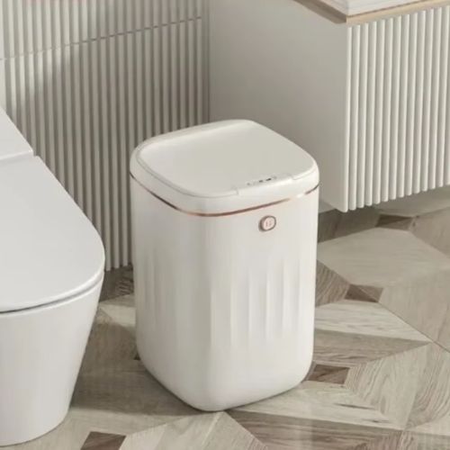 poubelle salle de bain blanche entre wc lavabo